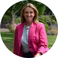 Headshot photo of Jo Slater in the school grounds. 